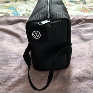 12x7x4 inch canvas travel case with Volkswagen logo. Never used.